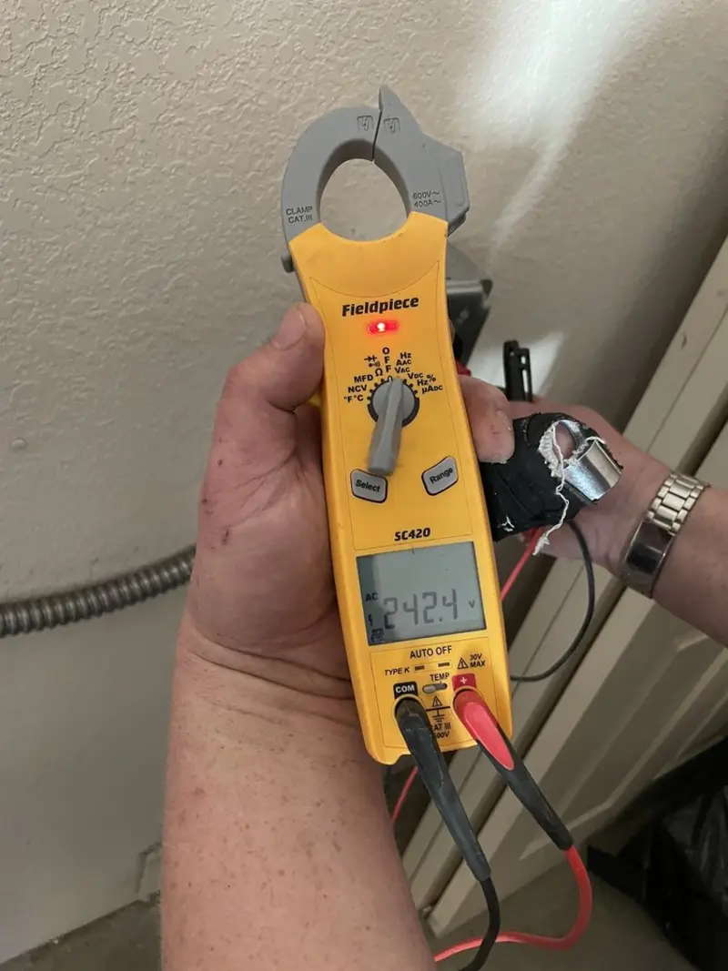 Voltage testing with clamp meter during Ceiling Fan Installation in Merrydale